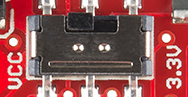 Switch to select between 3.3 and 5 volts on a red PCB.